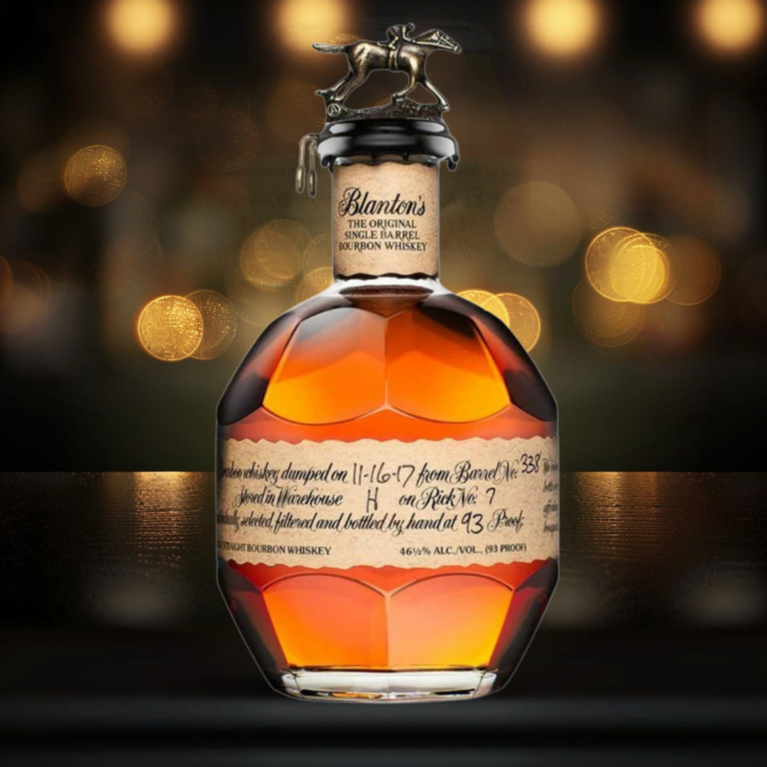 Blanton’s bourbon bottle in a dark elegant setting with warm golden lighting