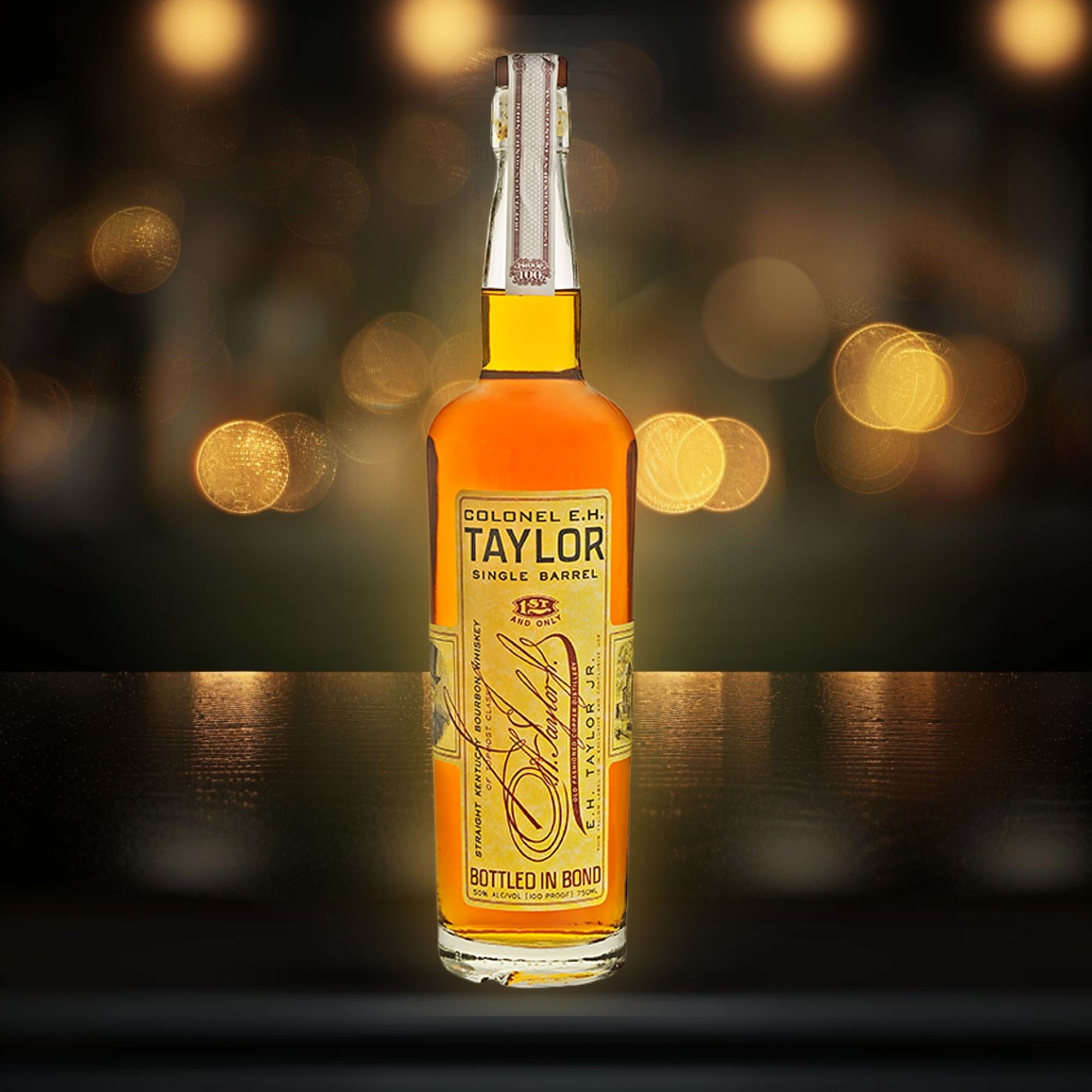 Colonel E.H. Taylor bourbon bottle in a dark elegant setting with warm golden lighting