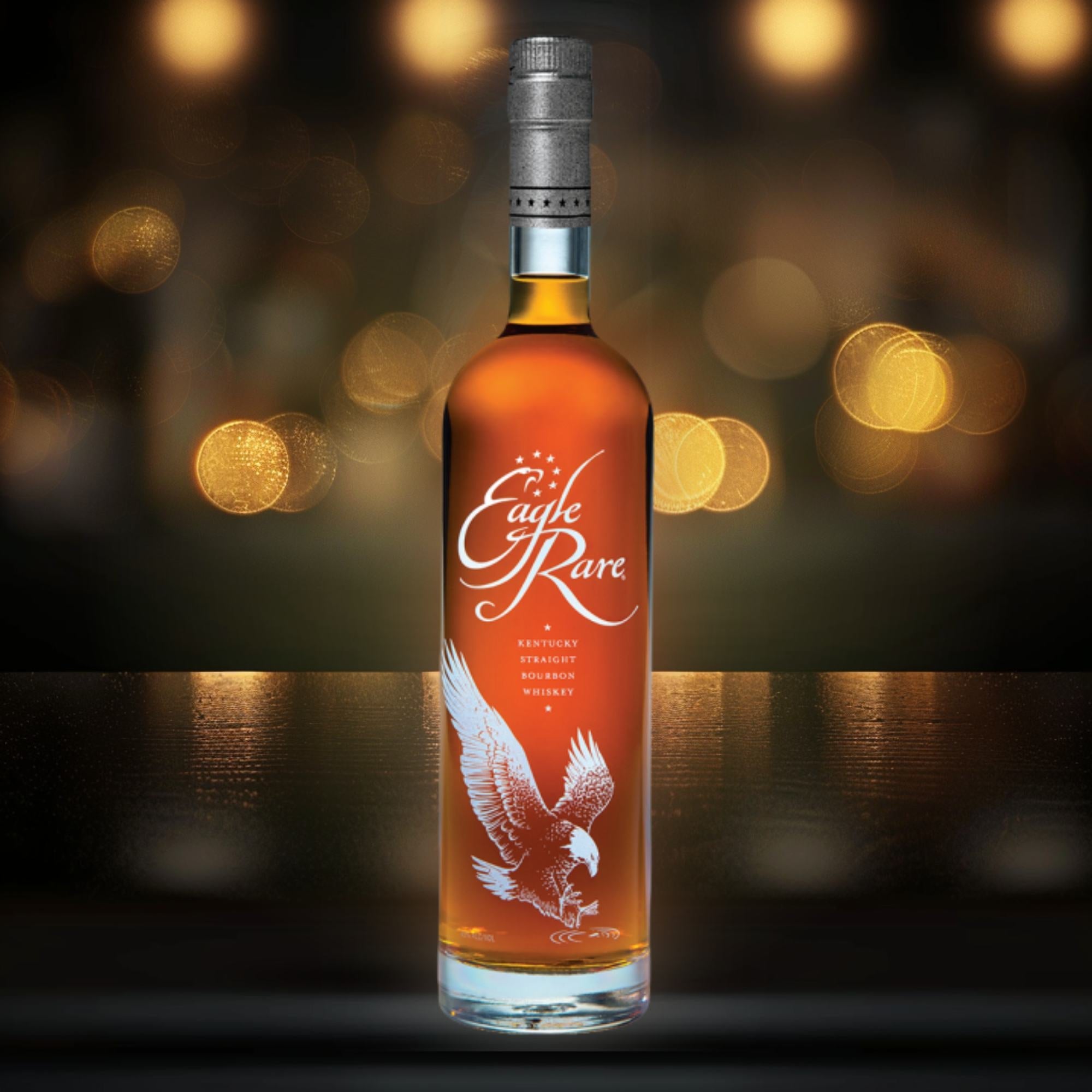 Eagle Rare bourbon bottle in a dark premium setting with warm golden lighting