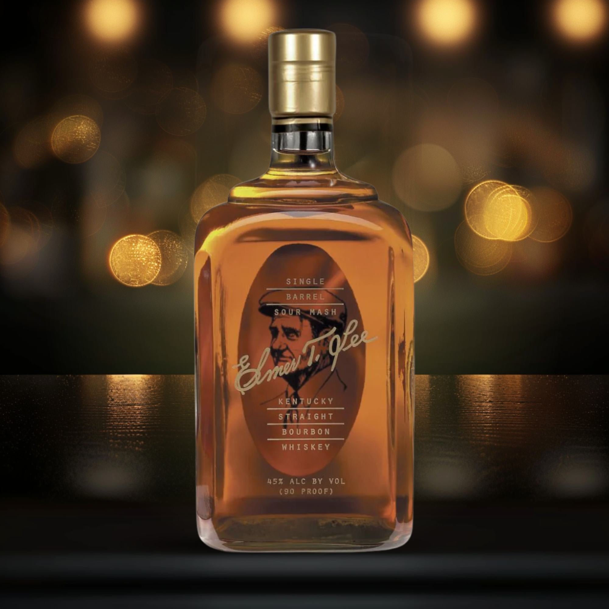 Elmer T. Lee single barrel bourbon bottle in a dark luxury setting with warm golden lighting