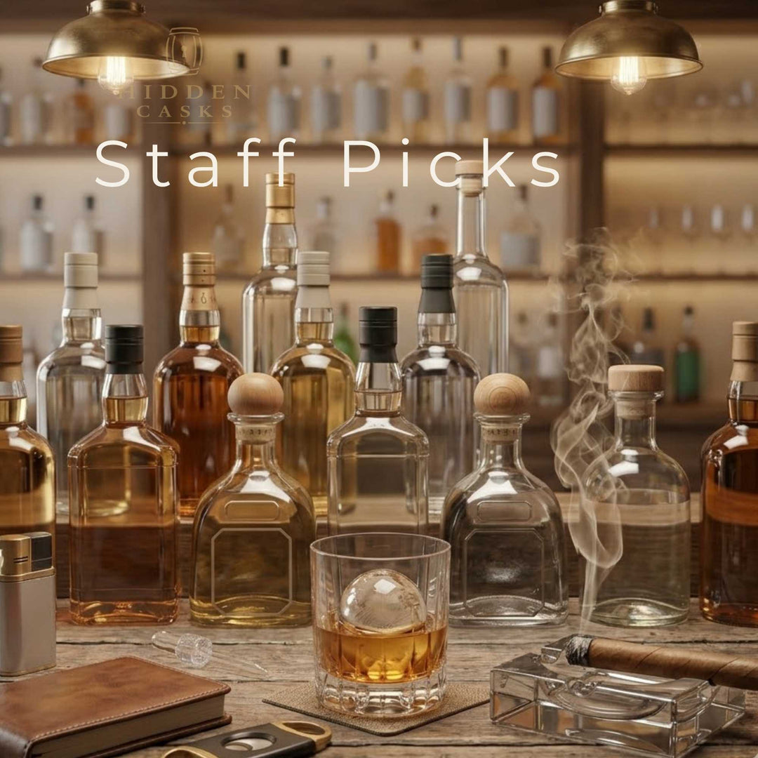 Staff selected premium spirits displayed on bar with warm lighting and curated feel