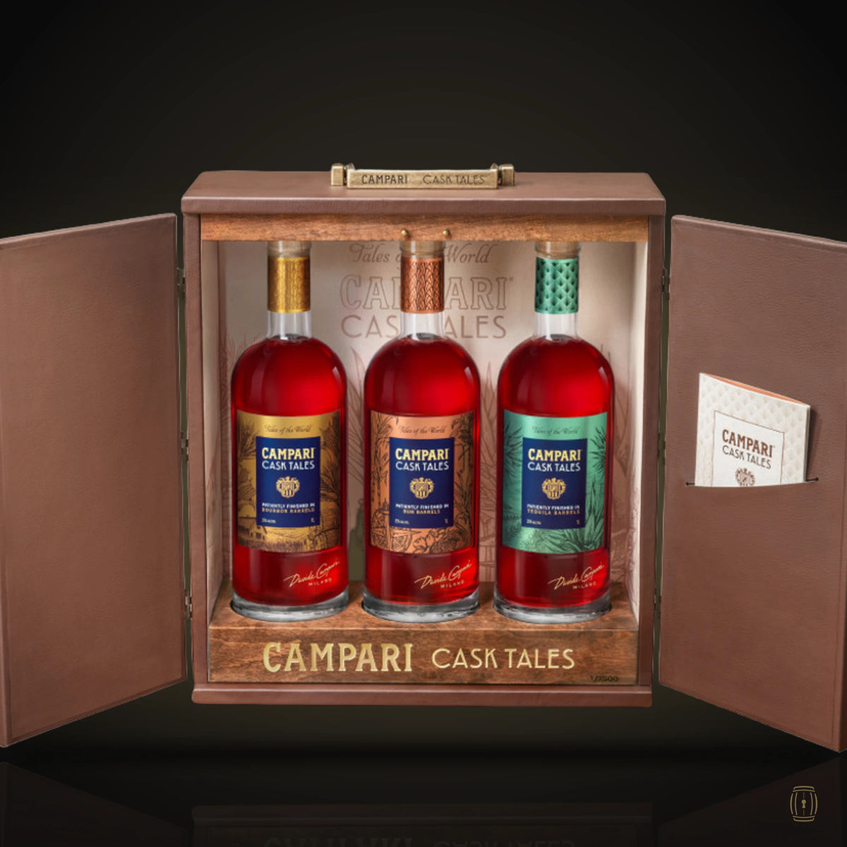 Campari Cask Tales Collection three bottles in open wooden cabinet