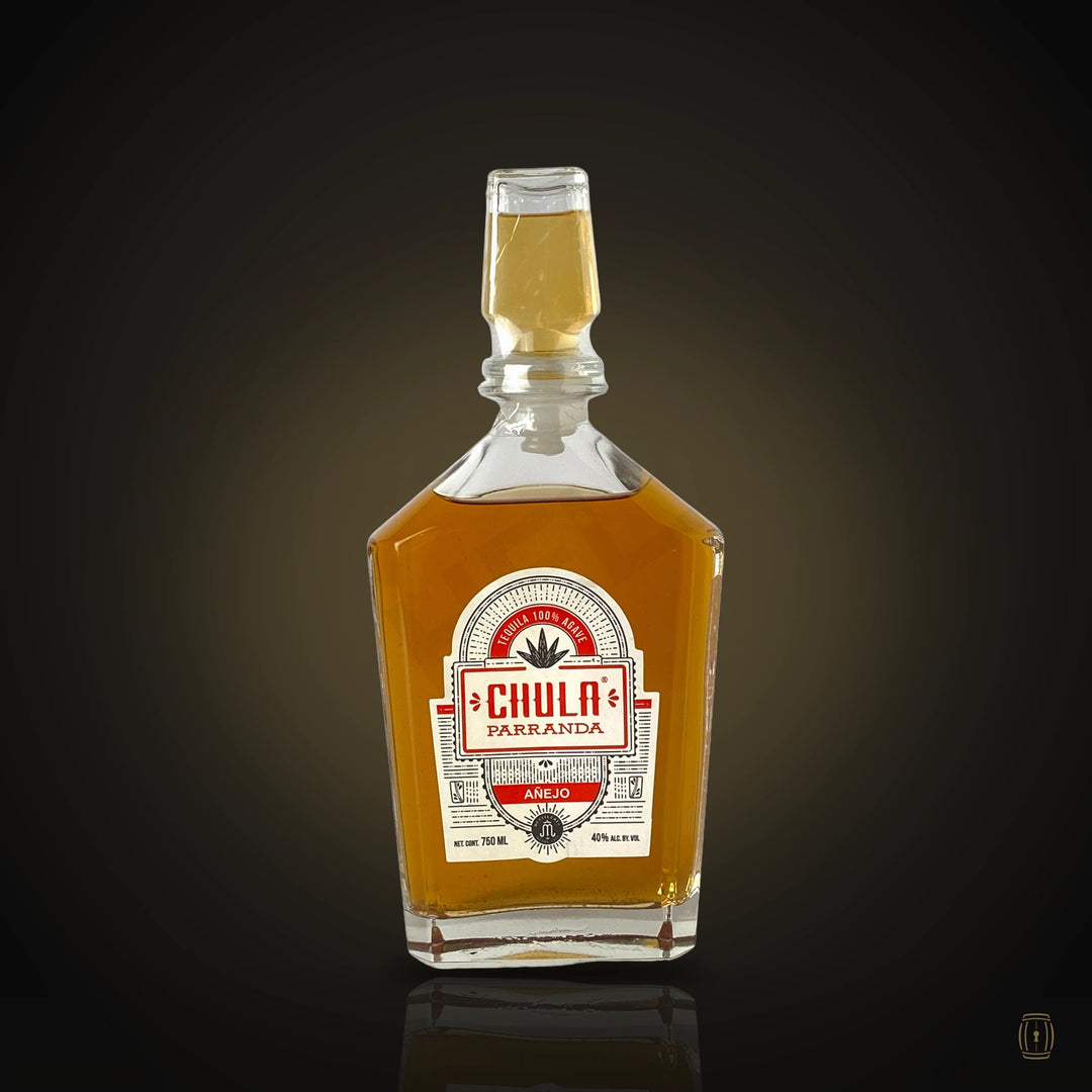 Chula Parranda Añejo decanter bottle with red label