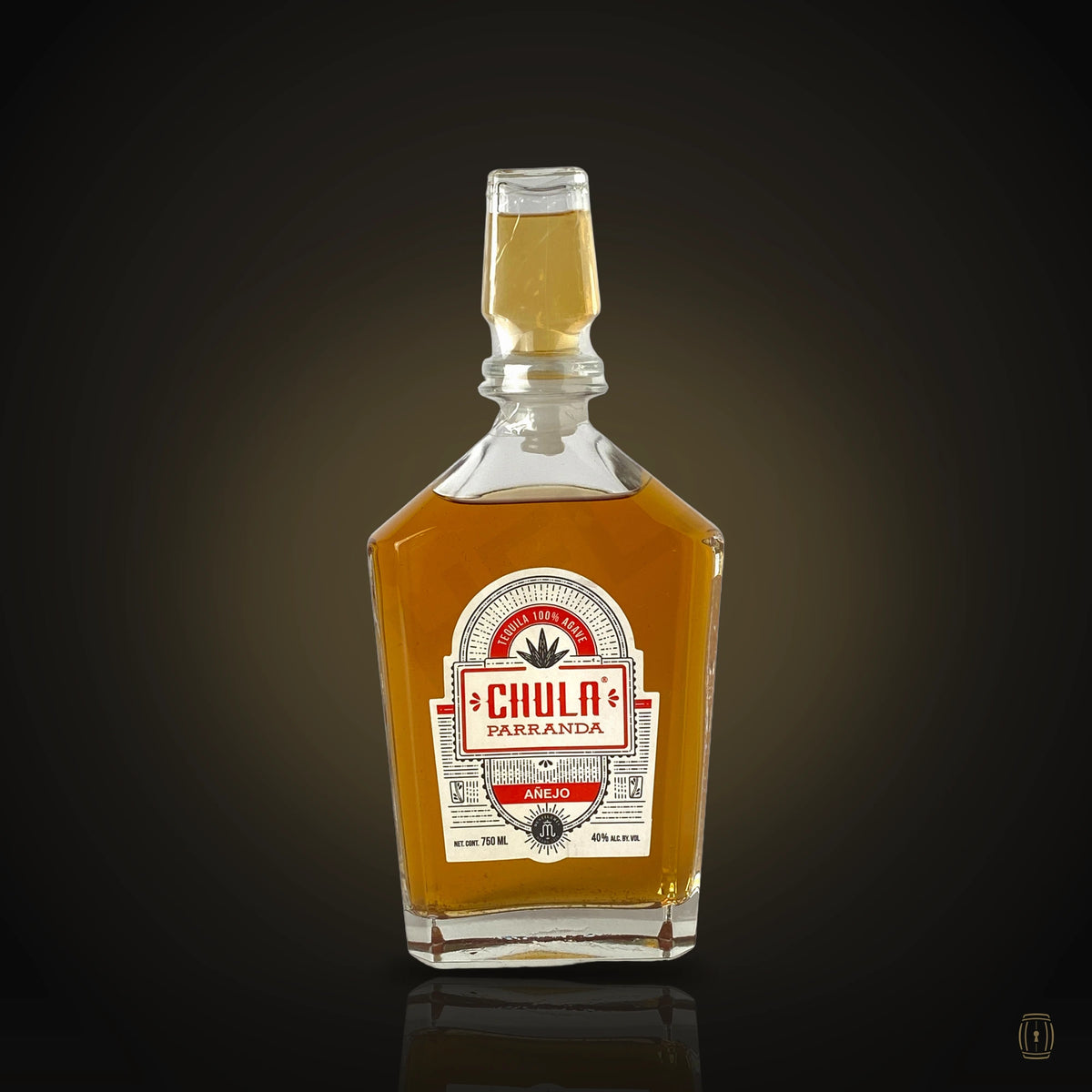 Chula Parranda Añejo decanter bottle with red label